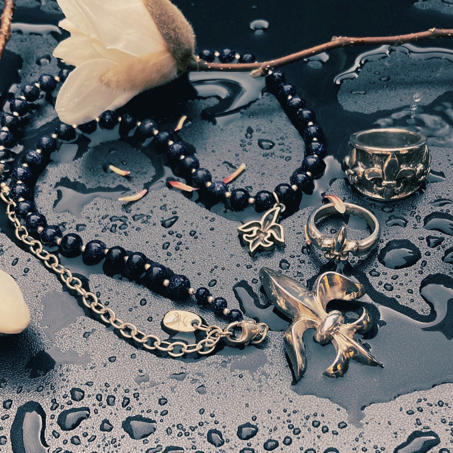 Tim & Mabel Fleur de Lis Blue Goldstone Necklace