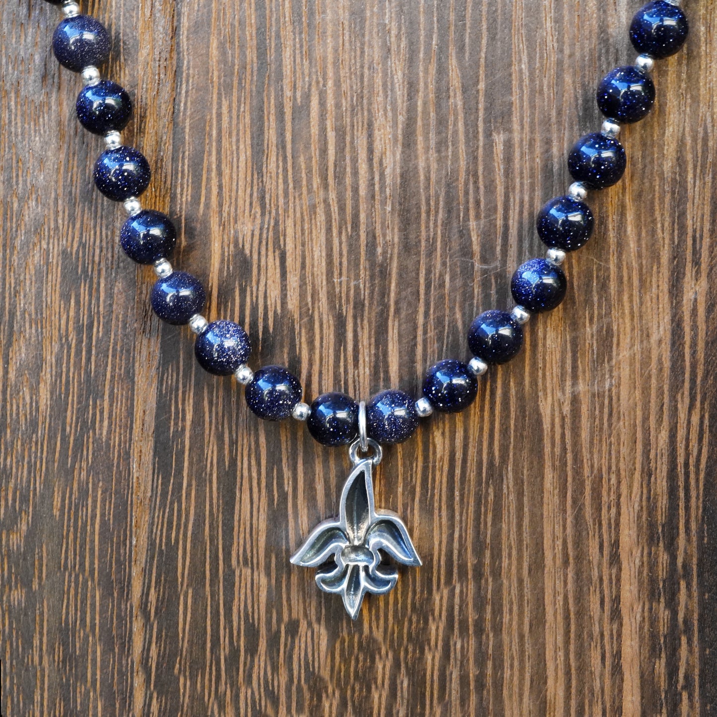 Tim & Mabel Fleur de Lis Blue Goldstone Necklace