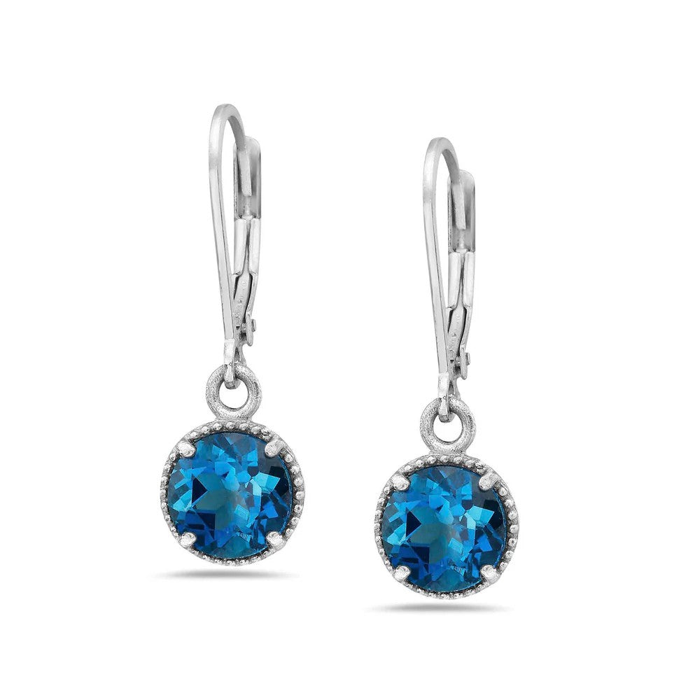 Pair of silver earrings with blue gemstones on a white background