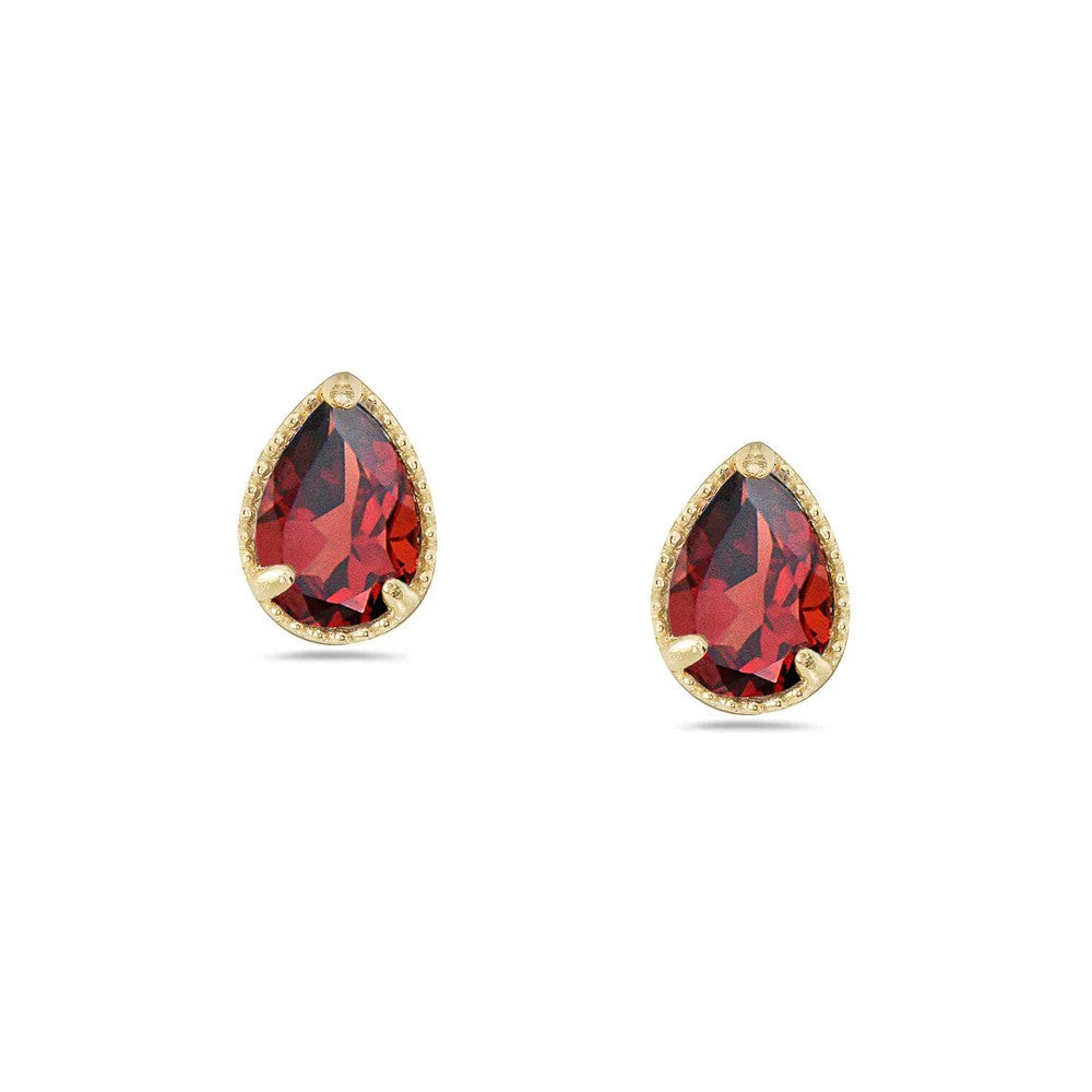 Gold earrings with red gemstones on a white background