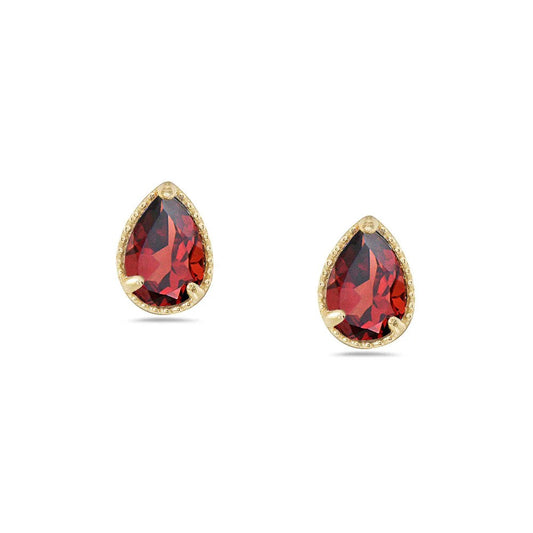 Gold earrings with red gemstones on a white background