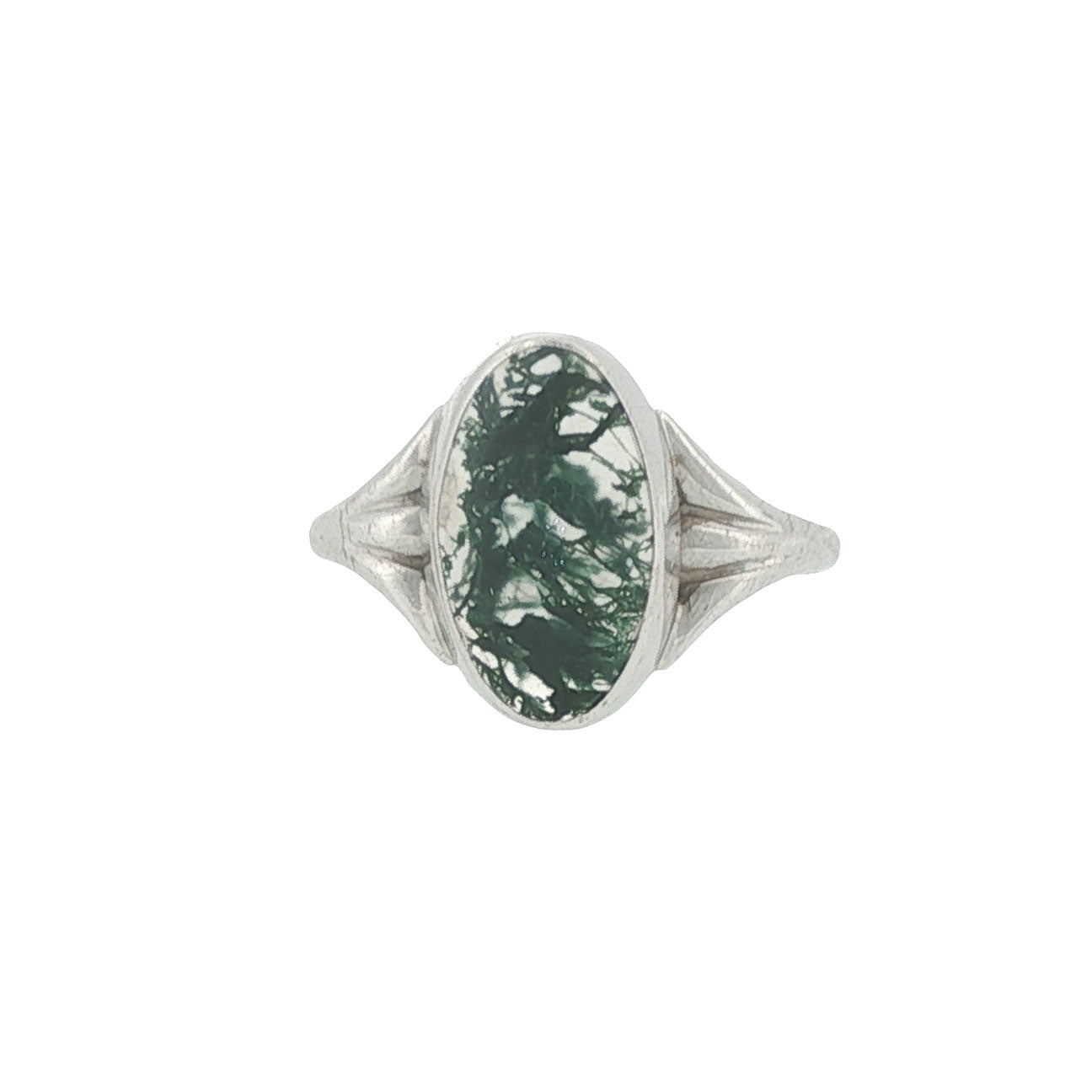 Silver ring with a green stone on a white background